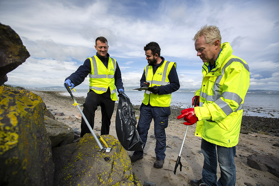 Wastewater team collecting, recording and bagging marine litter at Craigavad | NI Water News