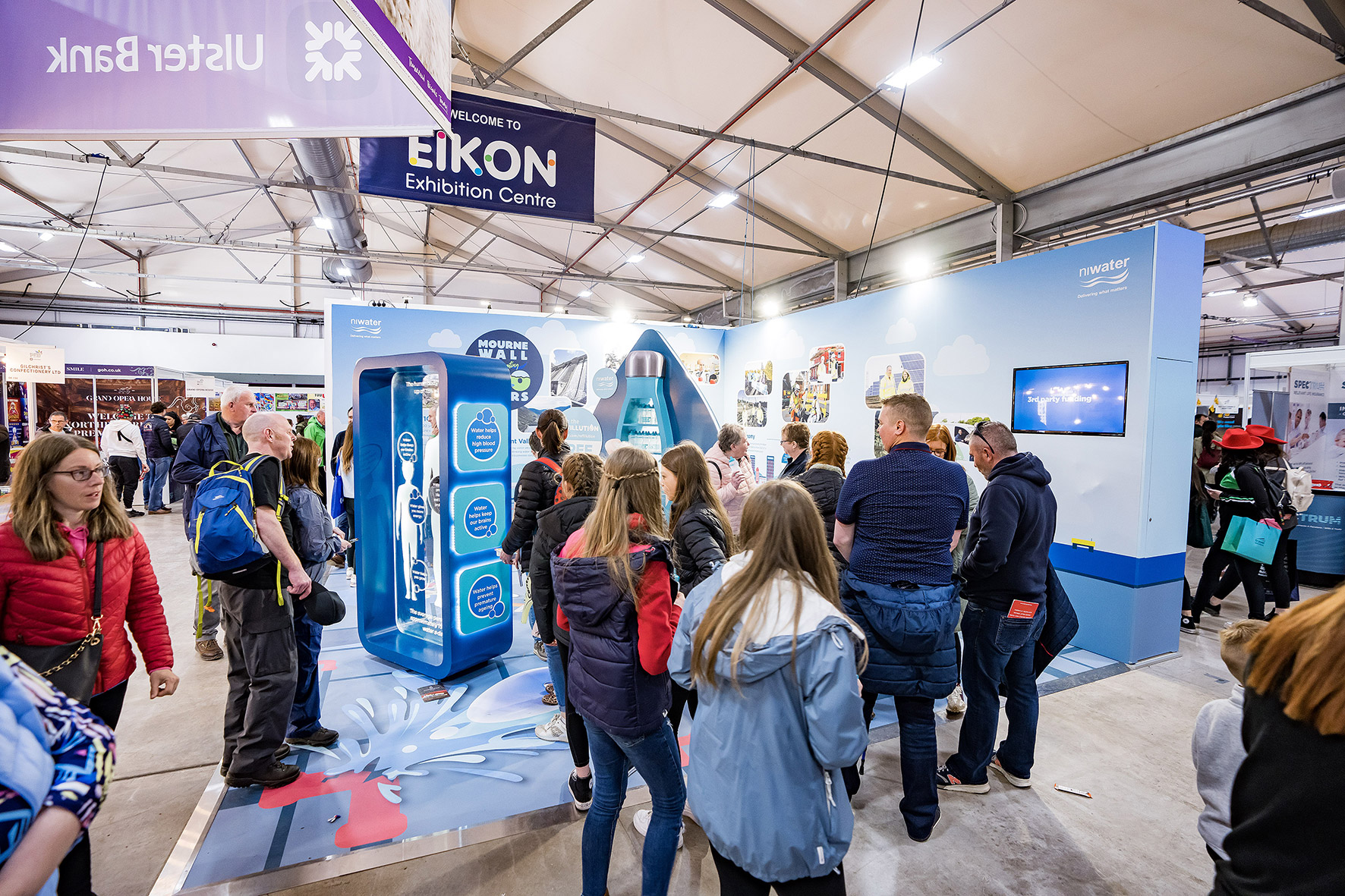 Group of people viewing NI Water stand at Eikon Exhibition Centre