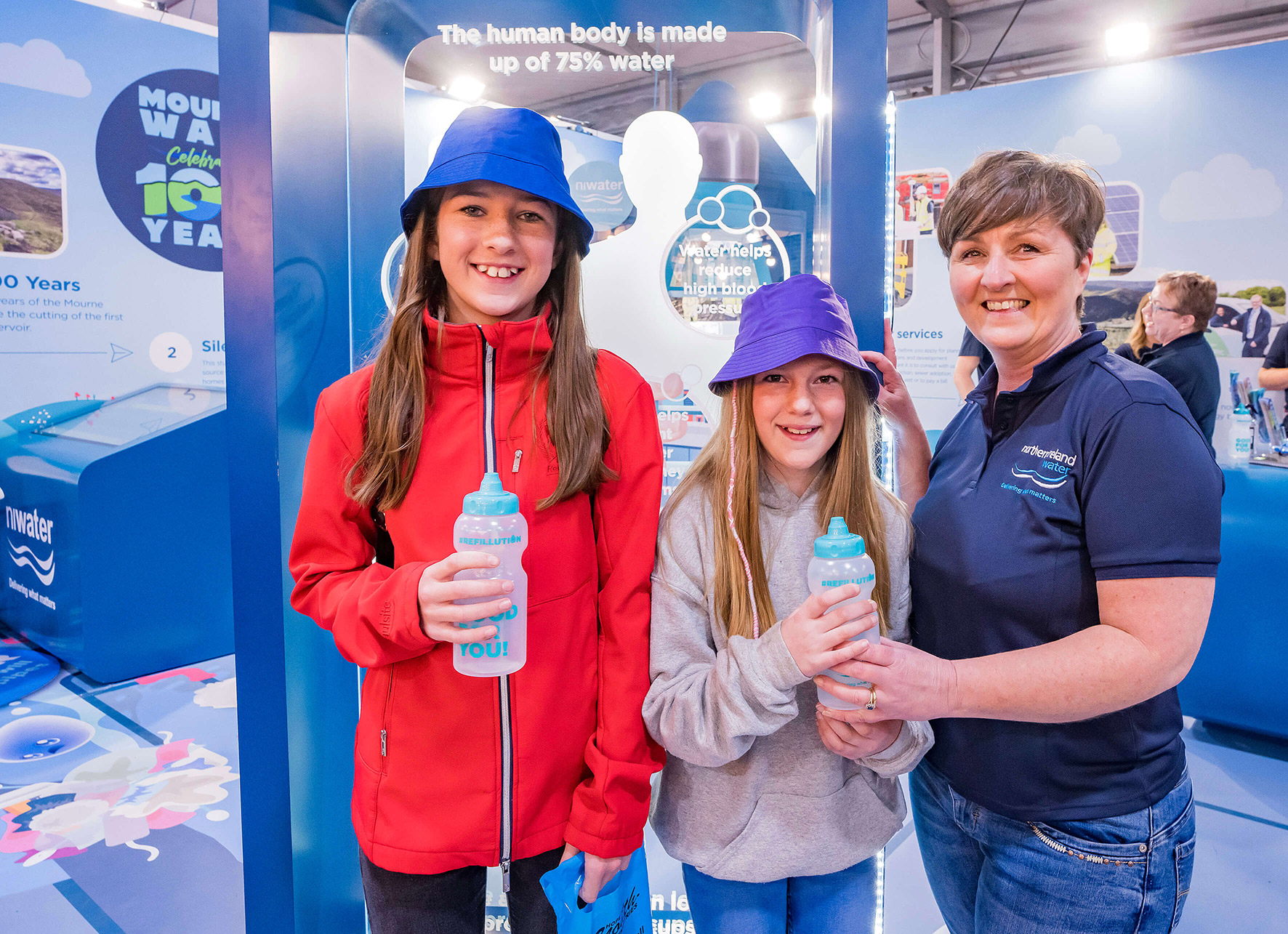 Children being given water bottles