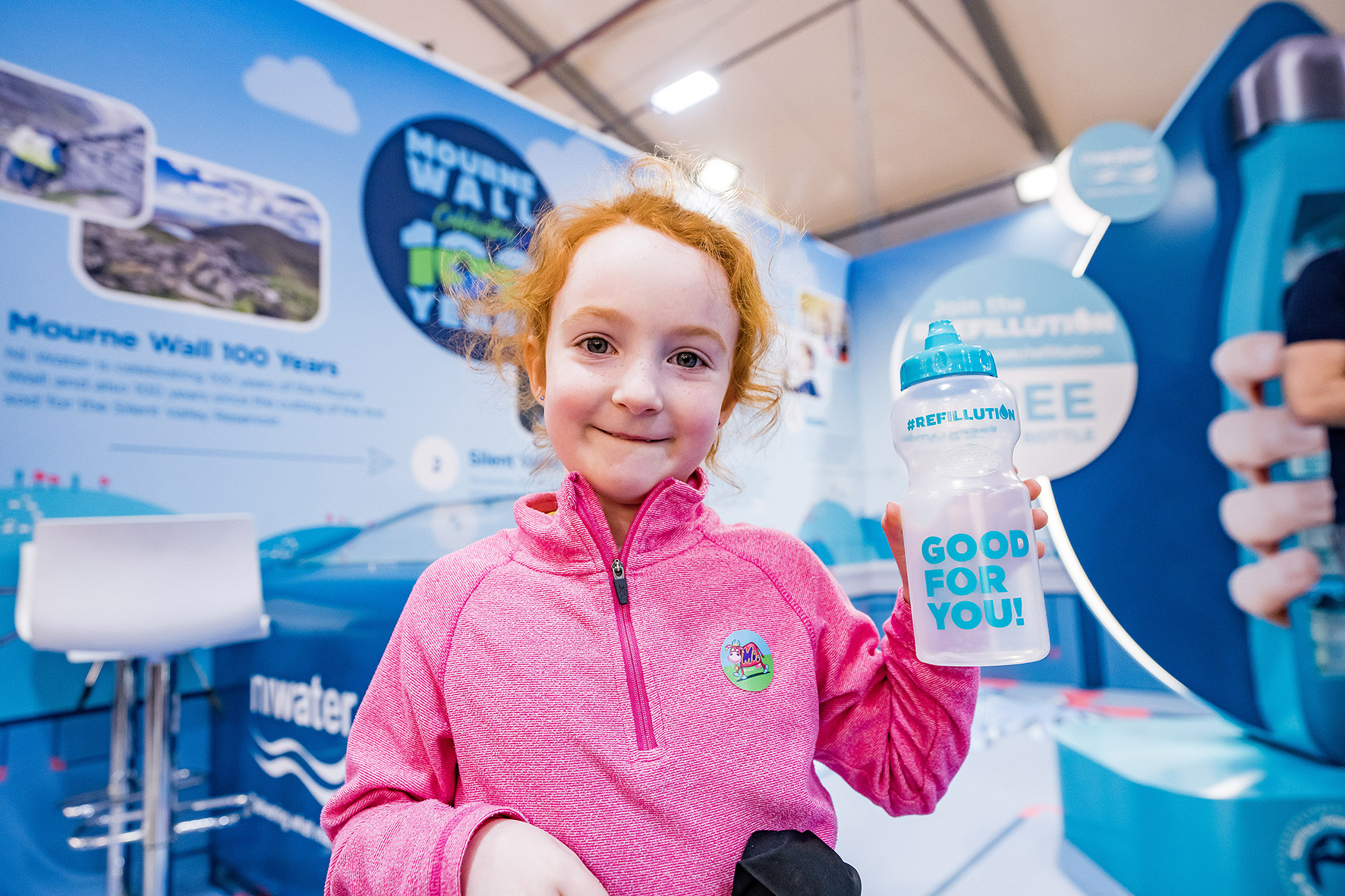 Girl holding Refillution water bottle