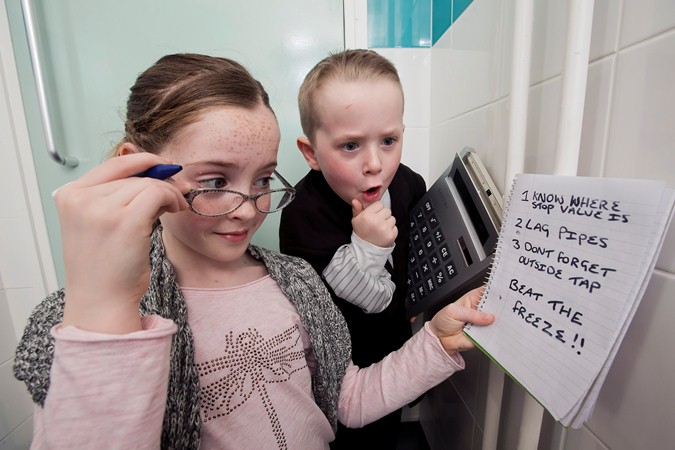 Lauren McCullagh (10) and Preston Parke (7) are shocked when they add up the cost of not protecting pipes in the home this winter. | NI Water News