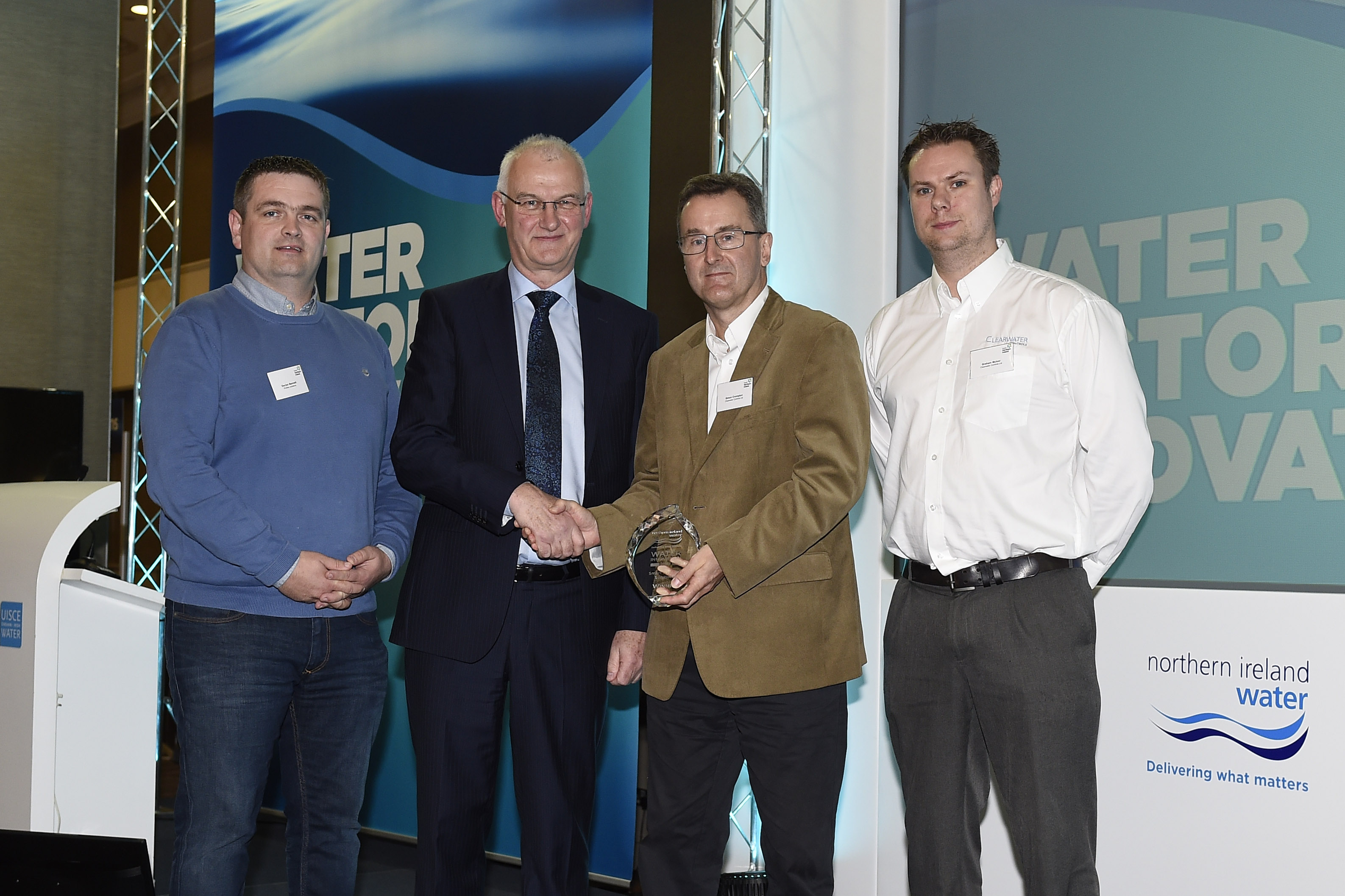 – Pictured are winners from last year’s category ‘to develop Smart Water and Waste Water Networks’, Clearwater Controls with NI Water’s Director of Asset Management Paul Harper | NI Water News