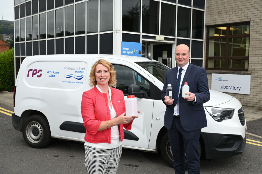 Photo of colleagues outside RPS building holding bottles