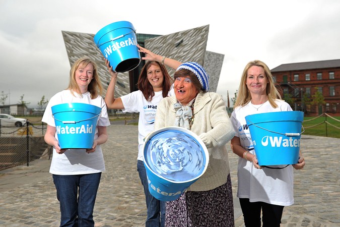 WaterAid supporters Christine McAllister, Anna Marshall, May McFetridge, and Celine Rodgers (WaterAid NI Secretary) pictured making a splash outside the Titanic Signature Building | NI Water News