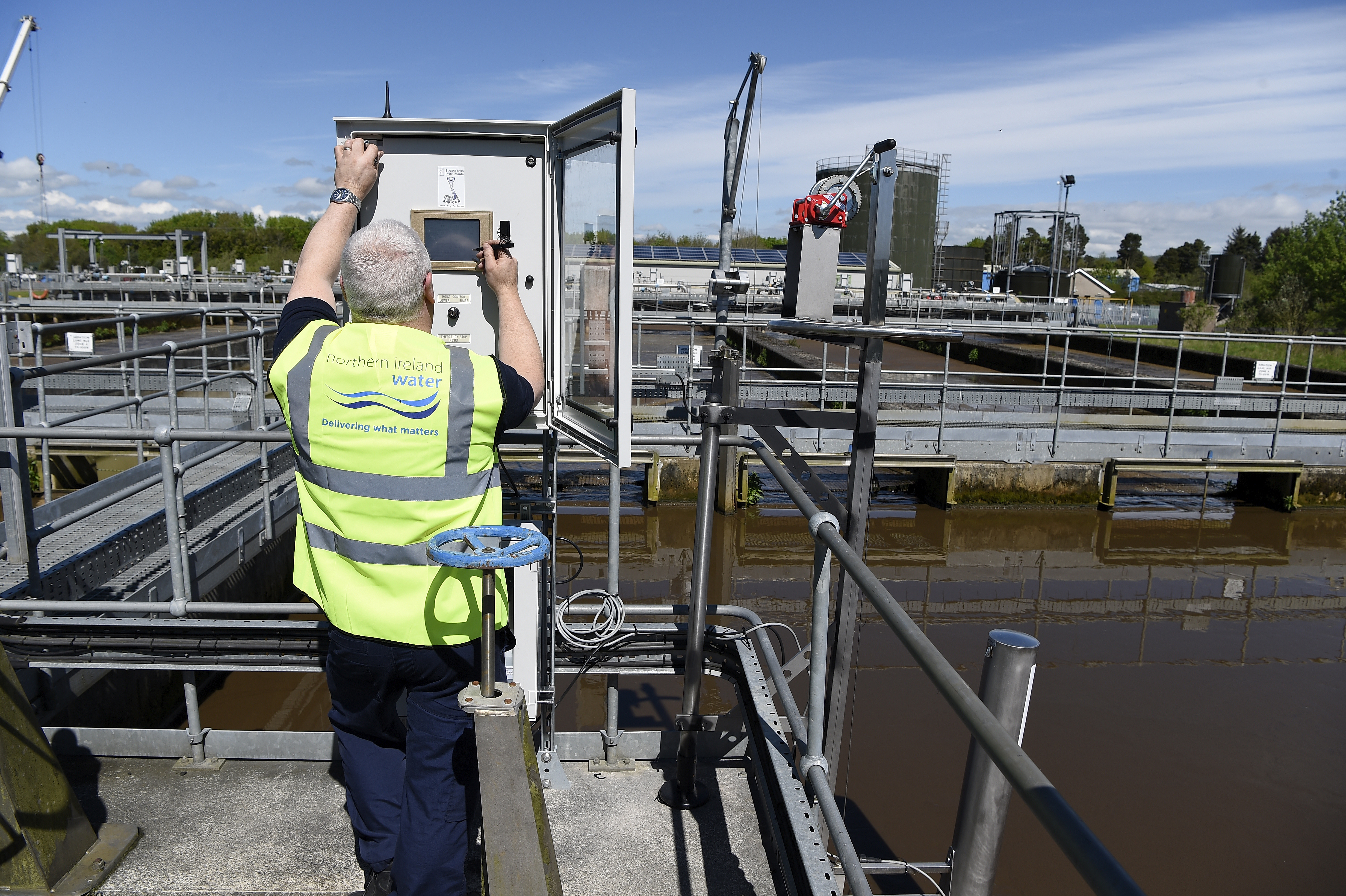 Northern Ireland Water employee checking machine at a waste water treatment works location
