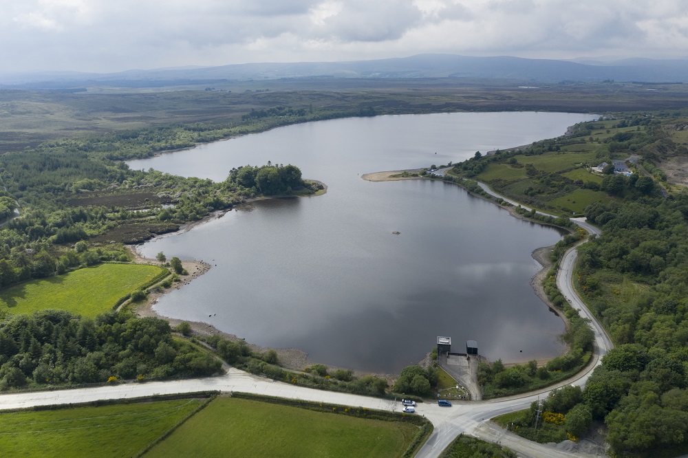 Aerial photo of Lough with mountains in background