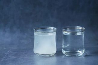 Two jars of water with one discoloured